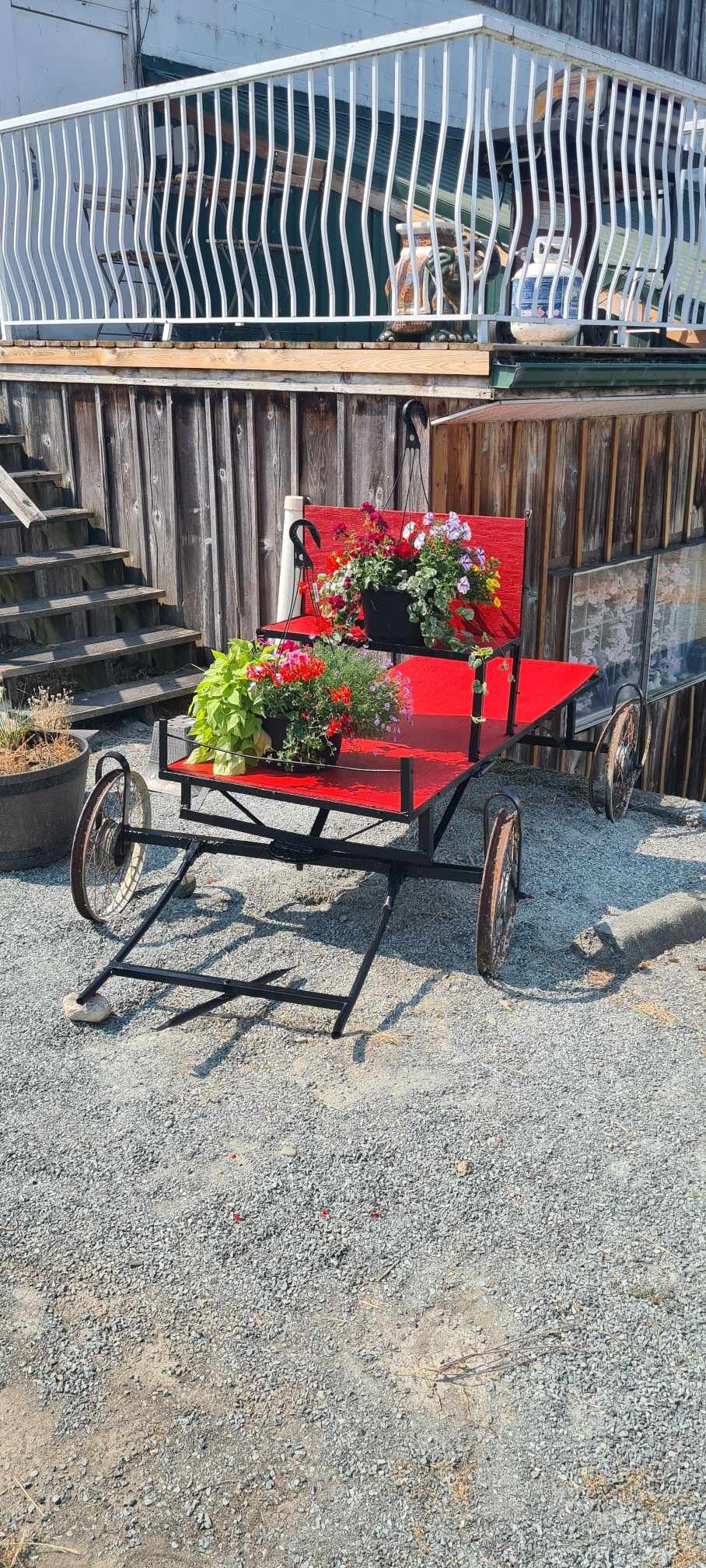 Cart and flowers decorating the stairs by the studio